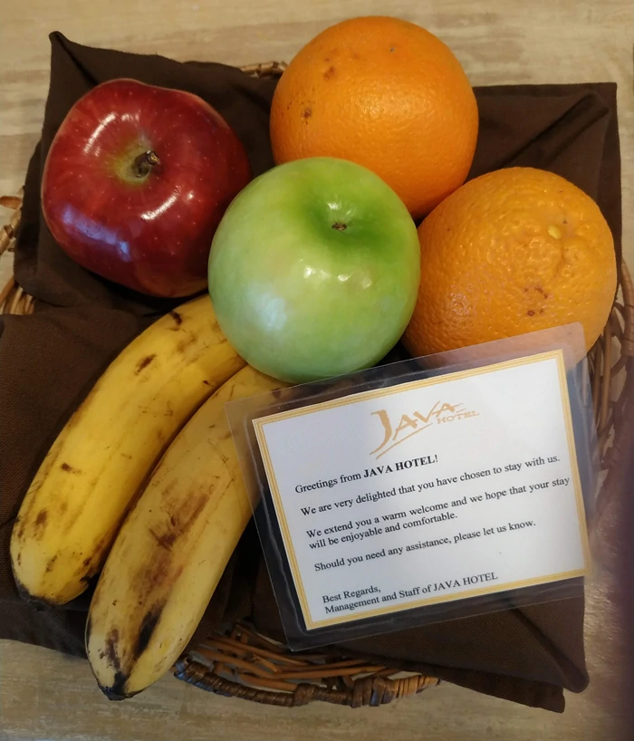 Fruits in bedroom and welcome words at Java Hotel
